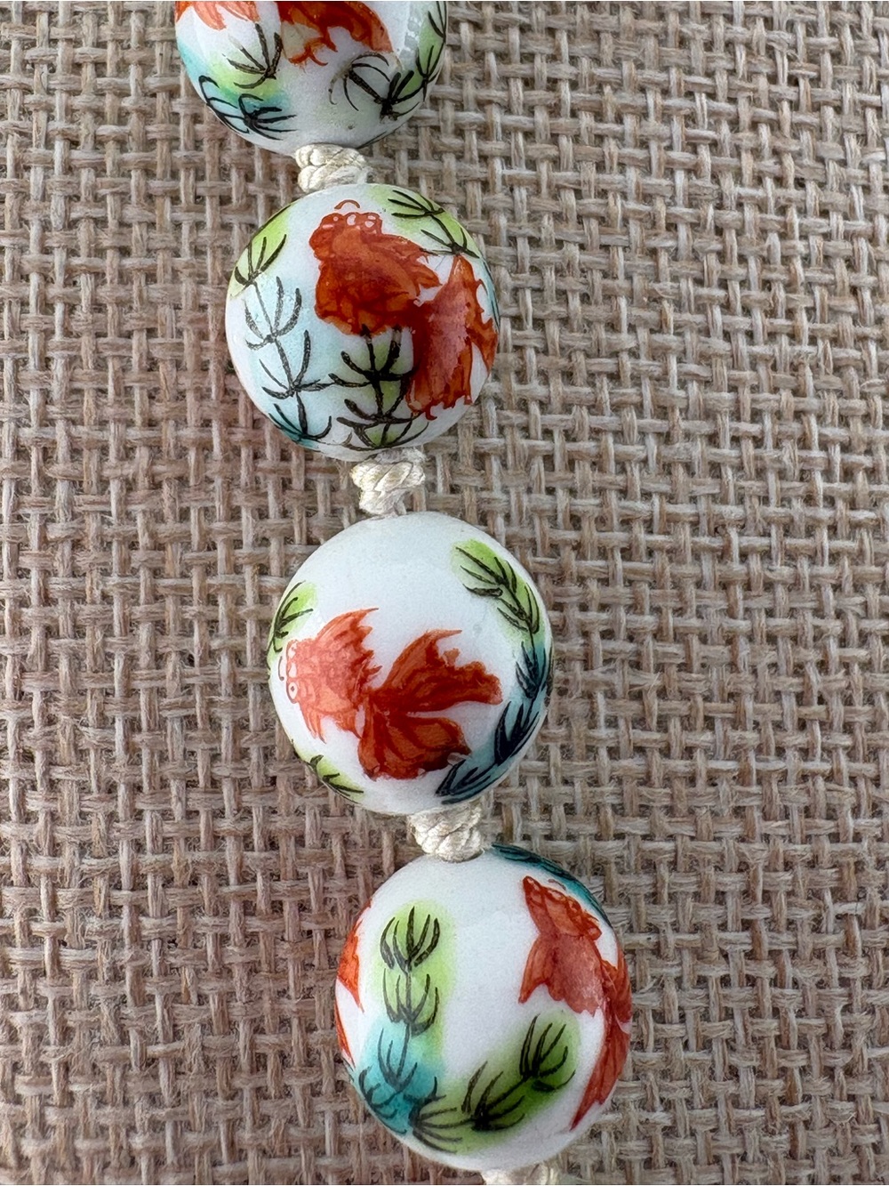 Hand-Painted Fantail Goldfish Ceramic Bead Necklace in White, Red & Green - Picture 3 of 5